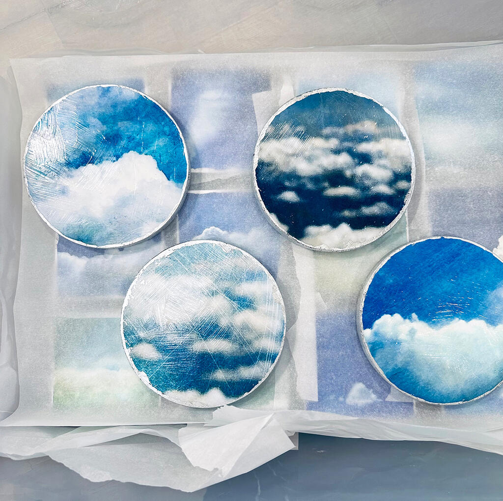 Clouds on round wood supports, silver-leafed edges