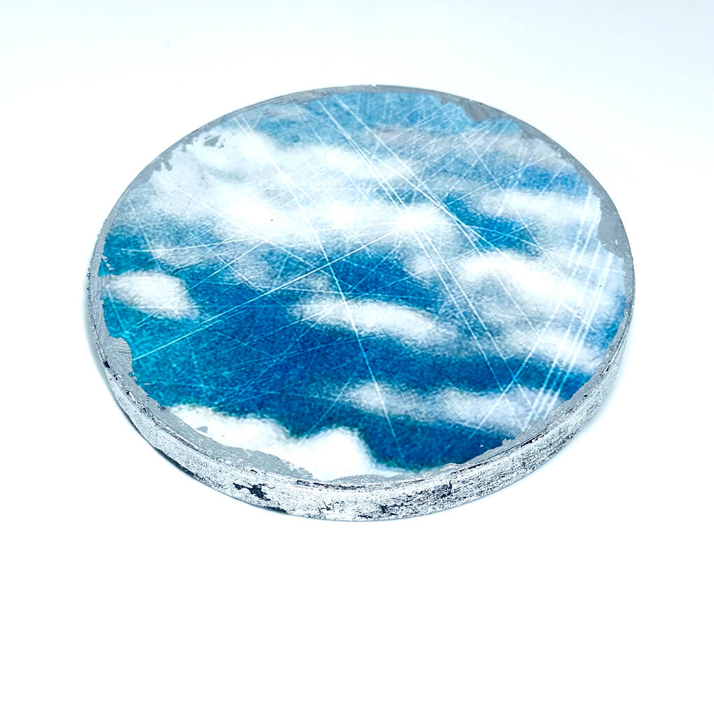 Cloud image on round wood support, silver-leafed edge