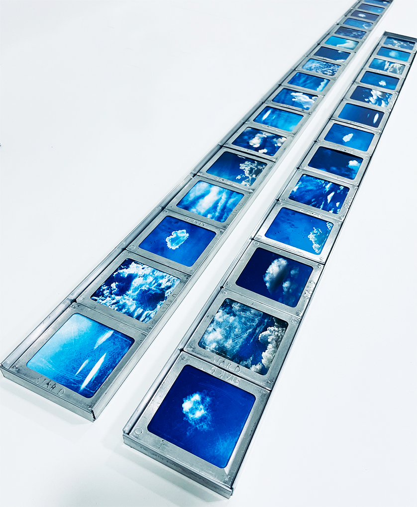 Cloud images mounted into vintage aluminum slide frames