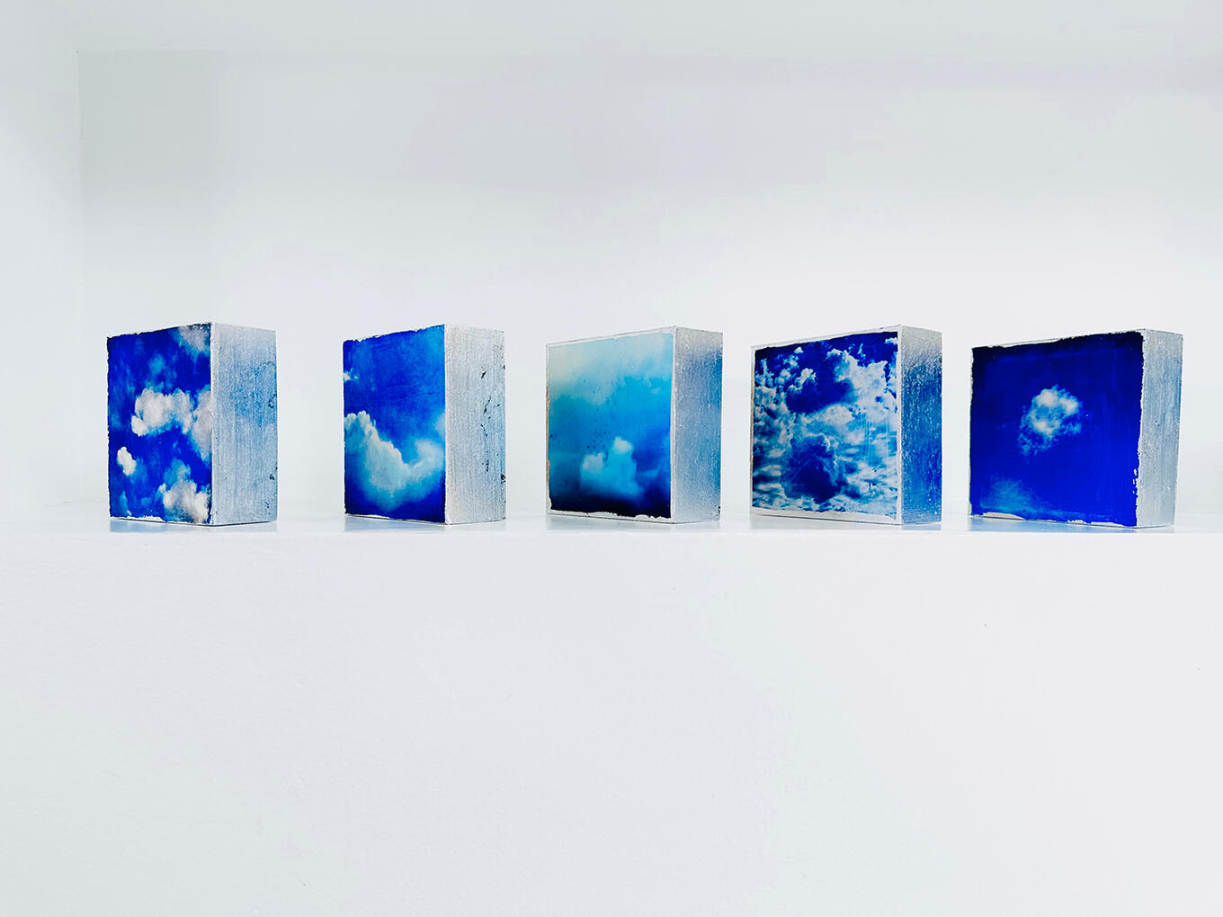 4" x 4" cloud images on wood supports will silver-leafed sides