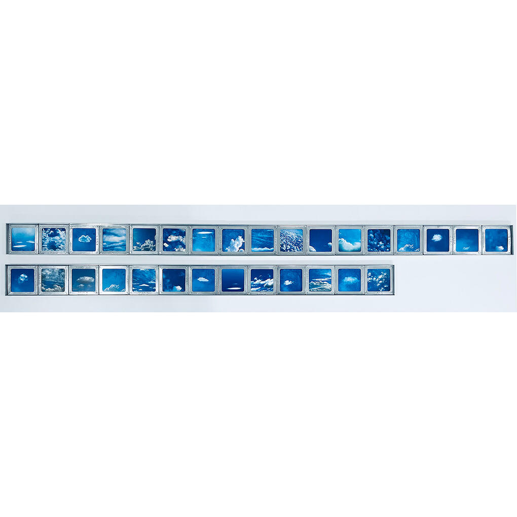 Cloud images mounted into vintage aluminum slide frames