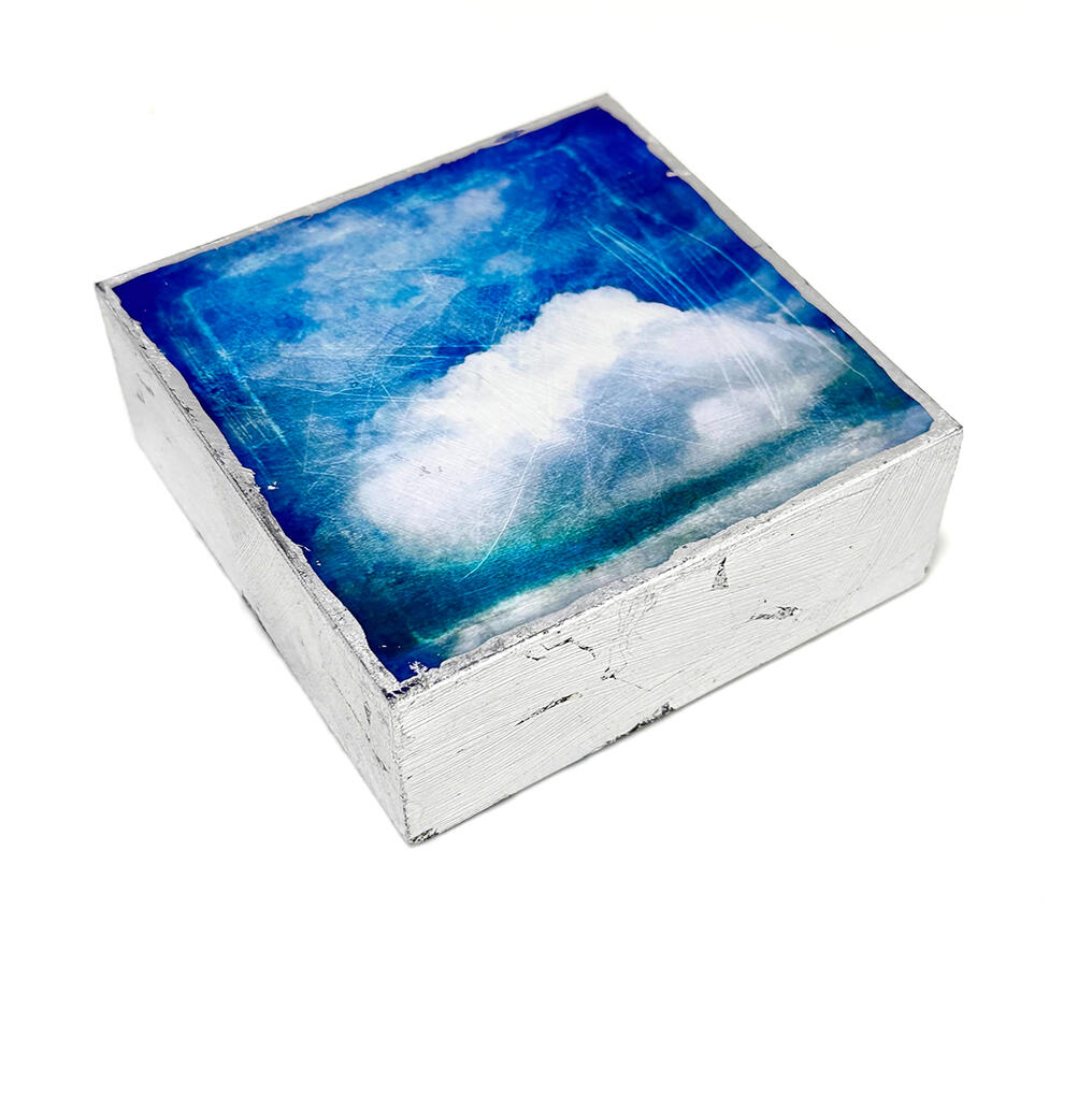 4" x 4" cloud image mounted on wood, silver-leafed sides