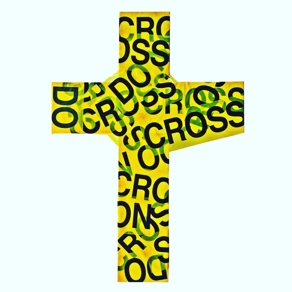 Wood cross wrapped in caution tape