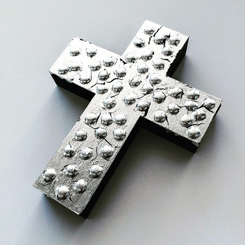Nailheads, black paint and silver leaf applied to wood base