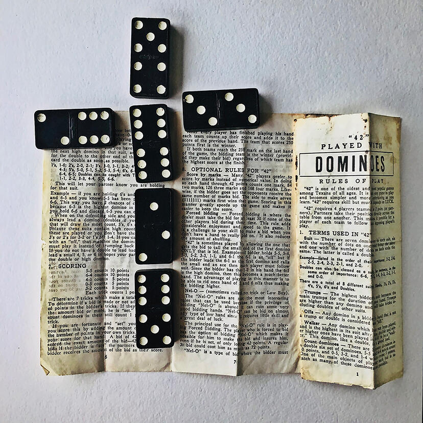 Photograph of vintage dominoes and instructions