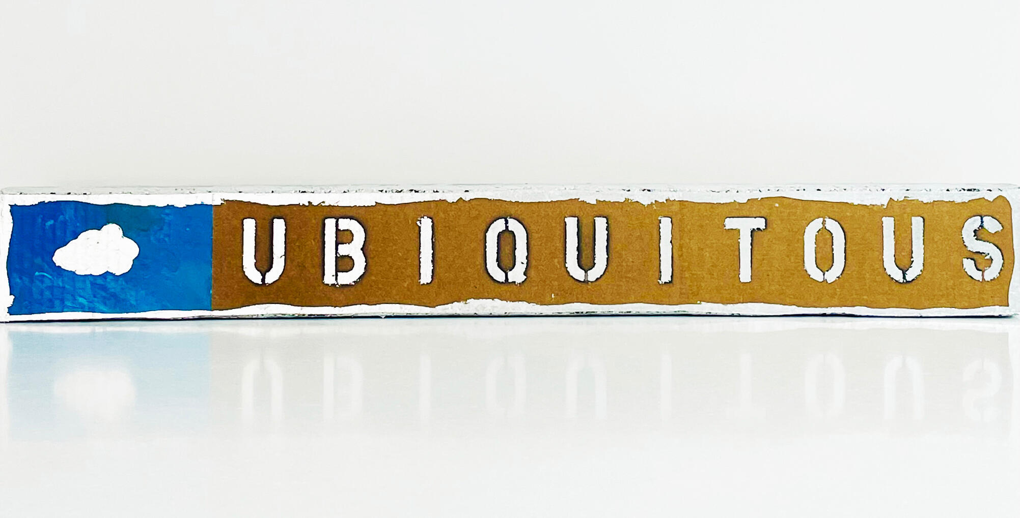 Ubiquitous. Cardboard, black paint and silver leaf on wood support